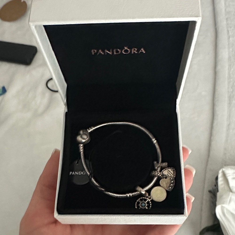 Never worn - pandora bracelet with 3 charms